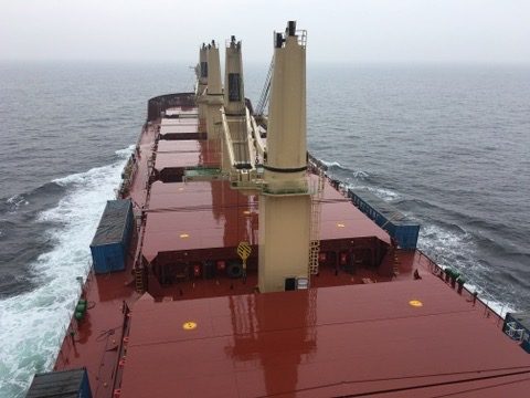 Geared bulk carrier on sea trials in grey conditions